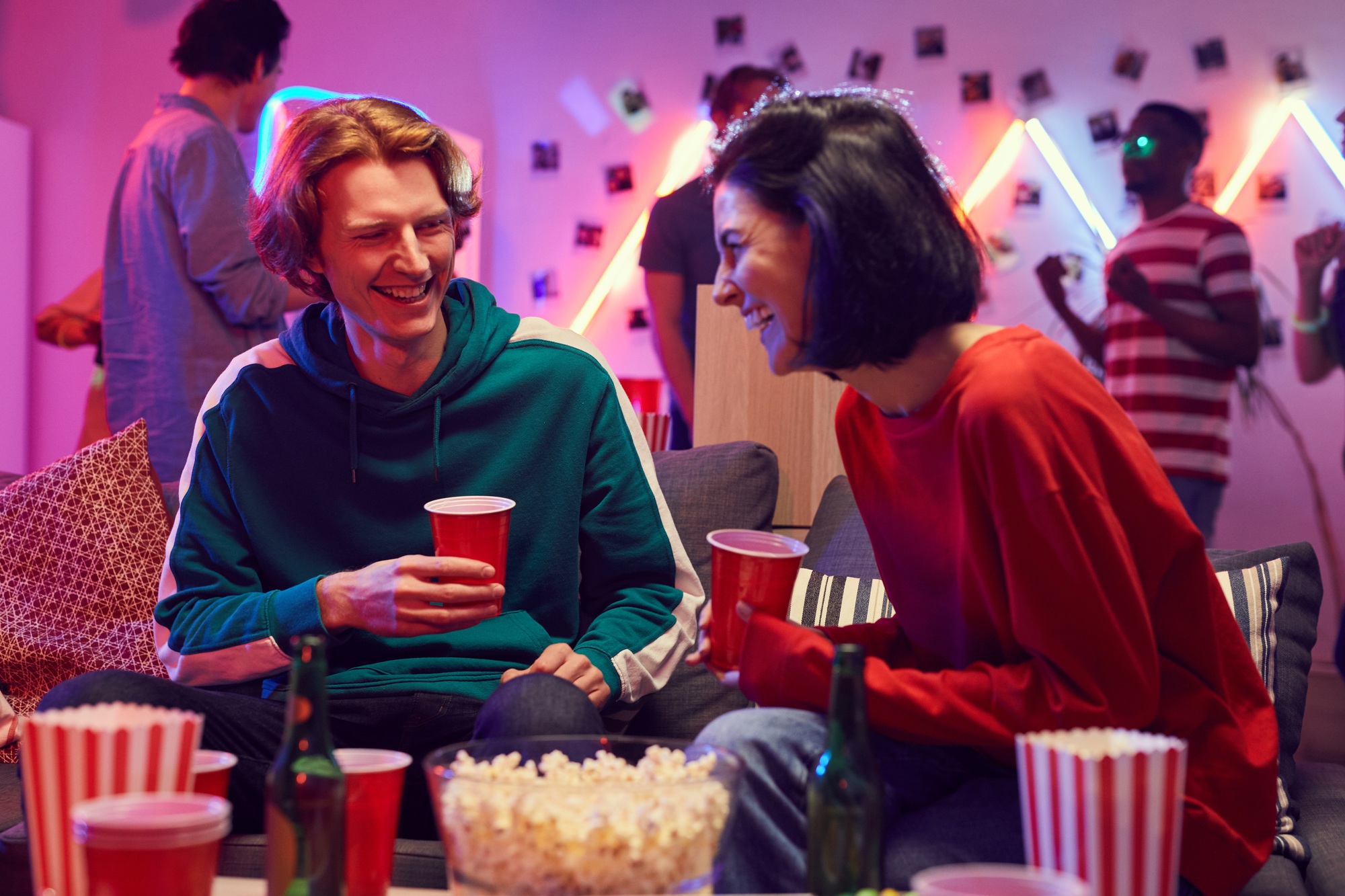 Young couple having fun at party